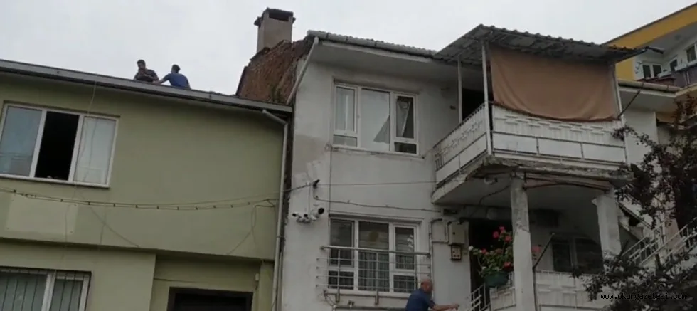 Hırsızlık zanlısı kadın, kaçtığı çatıda yakalandı