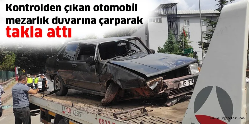 Kontrolden çıkan otomobil mezarlık duvarına çarparak takla attı